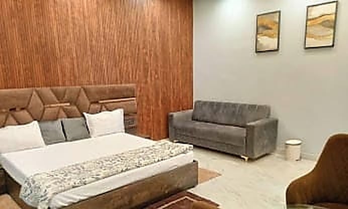 Luxury Master Cottage Bedroom Suite with Wood Wall