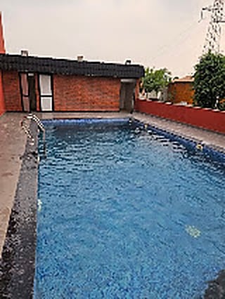 Crystal Swimming Pool Deck at The Krishna Farms